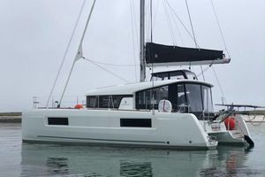 Lagoon 40 2019 Lagoon 40 catamaran on calm water, featuring sleek design and modern sails.