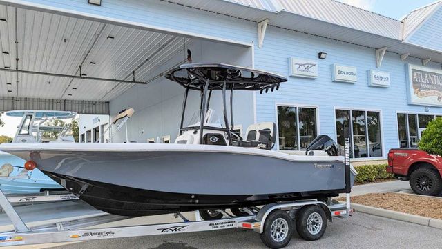 Tidewater 210LXF 2024 Tidewater 210LXF boat on trailer outside dealership.