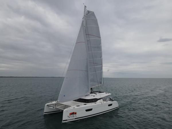 Fountaine Pajot Saona 47 2019 Fountaine Pajot Saona 47 catamaran sailing on a cloudy day.