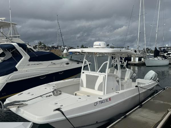 Twin Vee Catamaran 2021 Twin Vee Catamaran docked at marina under cloudy skies.