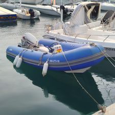 Protender HSF 420 Blue Protender HSF 420 inflatable boat, 2016 model, docked beside white boats.