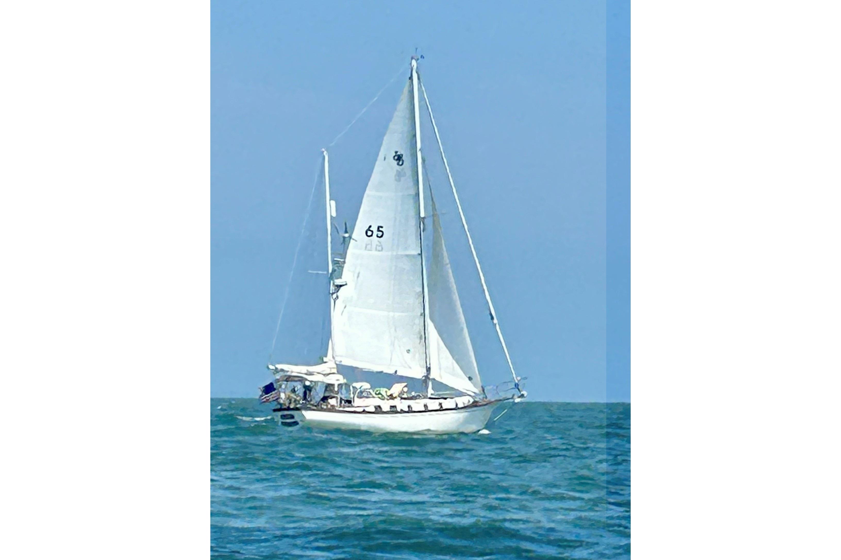 Shannon 38 Ketch 1981 Shannon 38 Ketch sailing on open sea under clear blue sky.