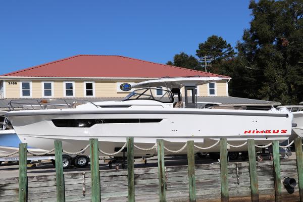 Nimbus Tender 11 2025 Nimbus Tender 11 boat docked near a building with a red roof.