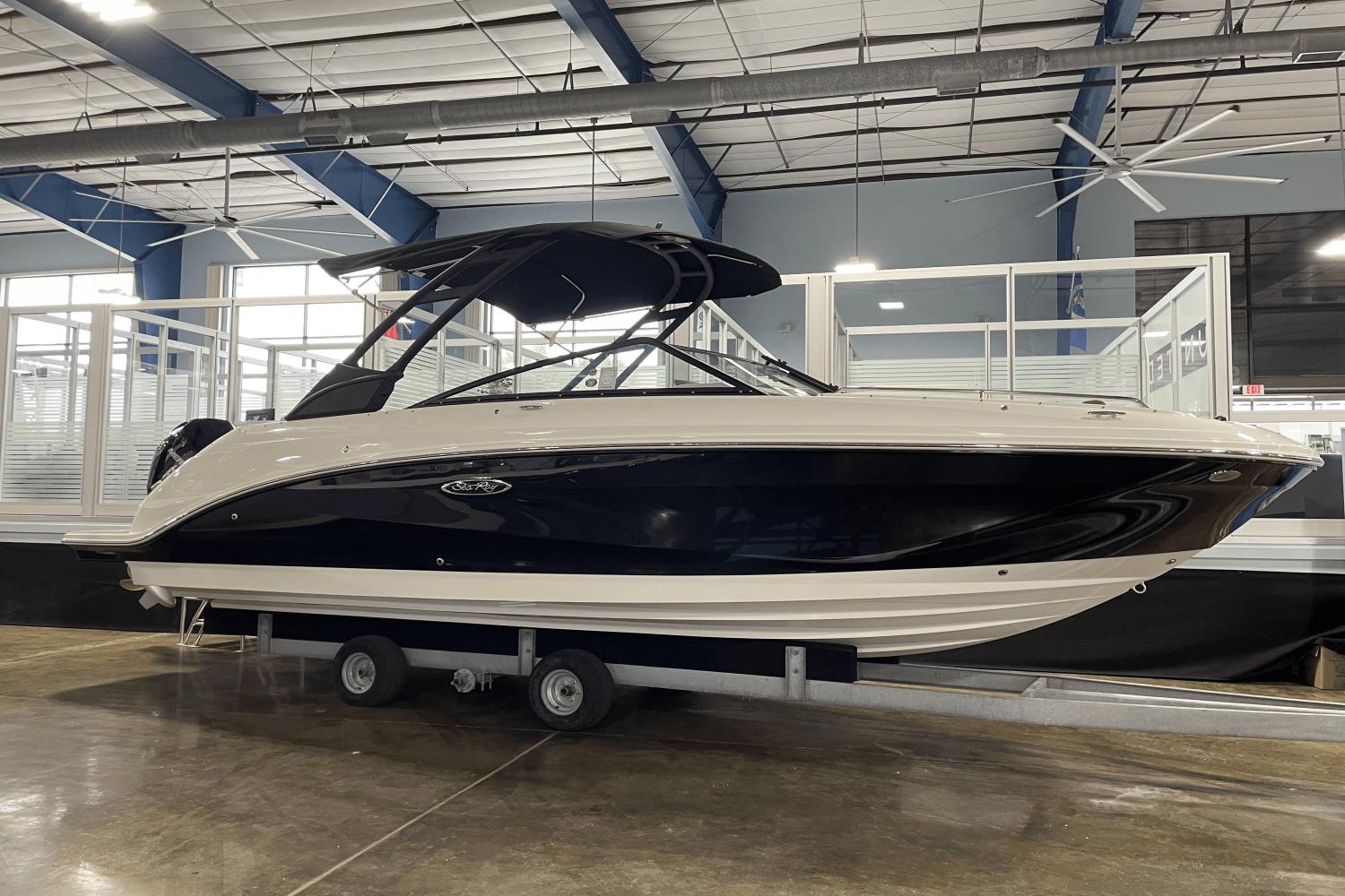 Sea Ray SDX 250 Outboard 2024 Sea Ray SDX 250 Outboard boat displayed indoors on a trailer.