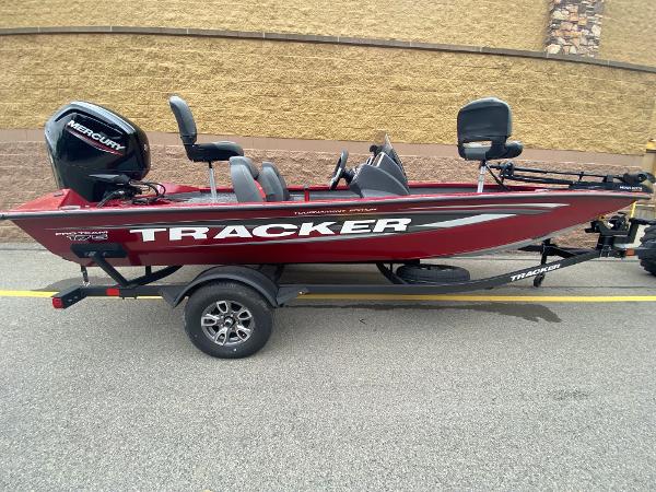 Tracker Pro Team 175 2025 Tracker Pro Team 175 boat on trailer, red color, side view.