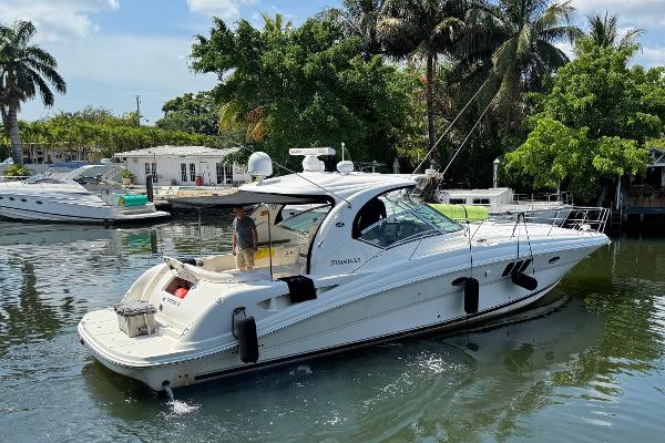 Sea Ray 44 Sundancer 2007 Sea Ray 44 Sundancer yacht cruising in a tropical marina.