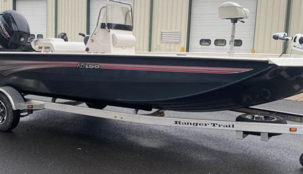 Ranger RB190 2024 Ranger RB190 boat on trailer, parked outside a garage.