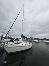 Catalina Catalina 30 MKII Tall Mast 1988 Catalina 30 MKII Tall Mast sailboat docked in a marina under cloudy skies.