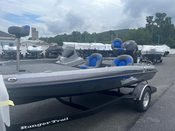 Ranger Z185 2025 Ranger Z185 bass boat with blue seats on a Ranger Trail trailer.