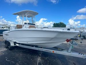 NauticStar 231 Hybrid 2025 NauticStar 231 Hybrid boat on trailer under blue sky.