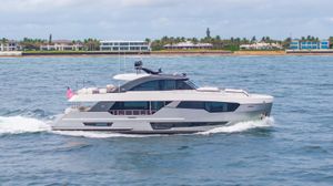 Ocean Alexander 28R 2021 Ocean Alexander 28R yacht cruising near a coastal residential area.