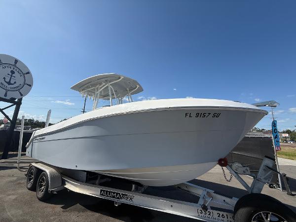 Aquasport 2300 Center Console 2022 Aquasport 2300 Center Console boat on trailer under clear blue sky.