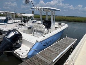 Robalo R230 Center Console 2022 Robalo R230 Center Console boat docked, featuring sleek design and powerful engine.