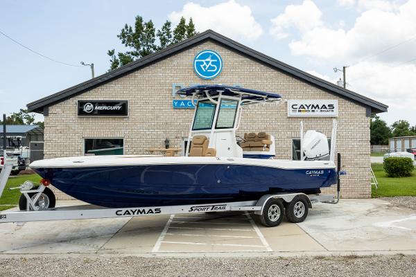 Caymas 26 HB 2025 Caymas 26 HB boat on trailer outside dealership.