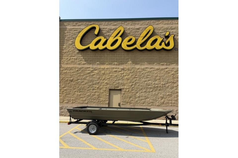Tracker Grizzly 1648 Utility 2026 Tracker Grizzly 1648 Utility boat outside Cabela's store.