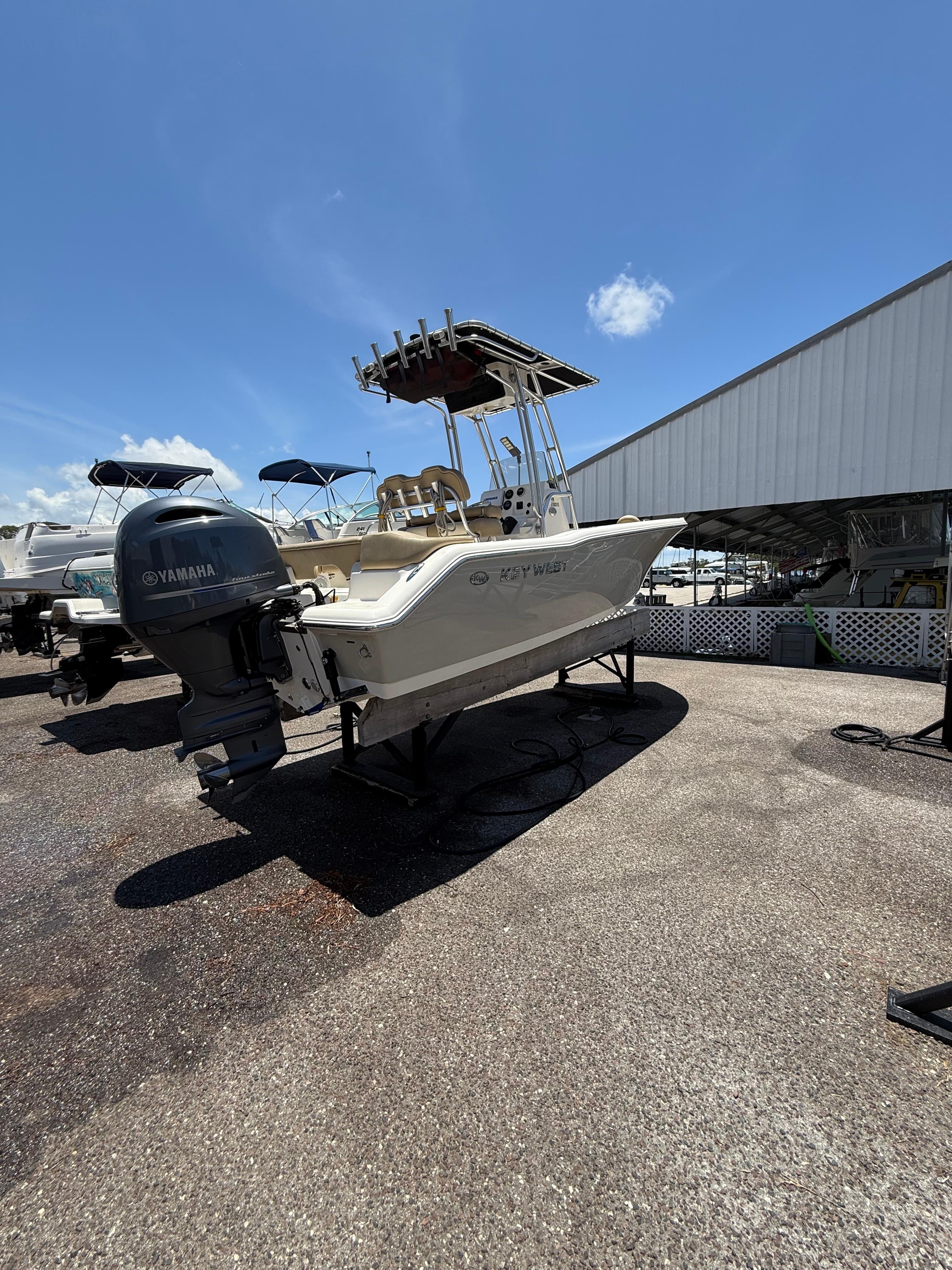 Key West 203 FS 2018 Key West 203 FS boat with Yamaha engine on display under clear blue sky.