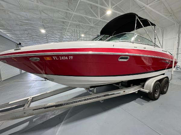 Four Winns H260 2012 Four Winns H260 boat on trailer in indoor storage facility.