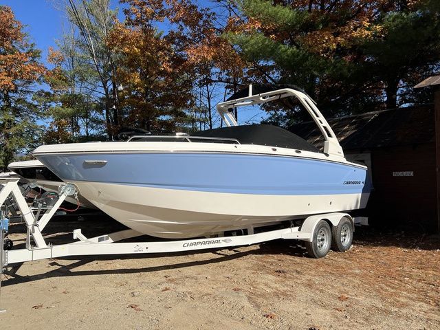 Chaparral 247 SSX 2025 Chaparral 247 SSX boat on trailer, surrounded by autumn trees.