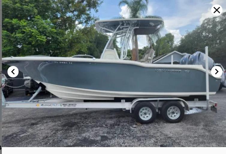 Key West 244 CC 2023 Key West 244 CC boat on trailer, parked outdoors.
