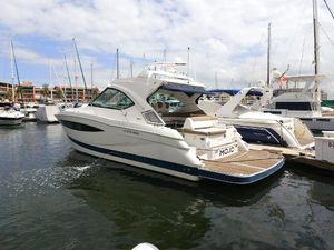 Four Winns H440 2016 Four Winns H440 yacht docked in marina, featuring sleek design and spacious deck.