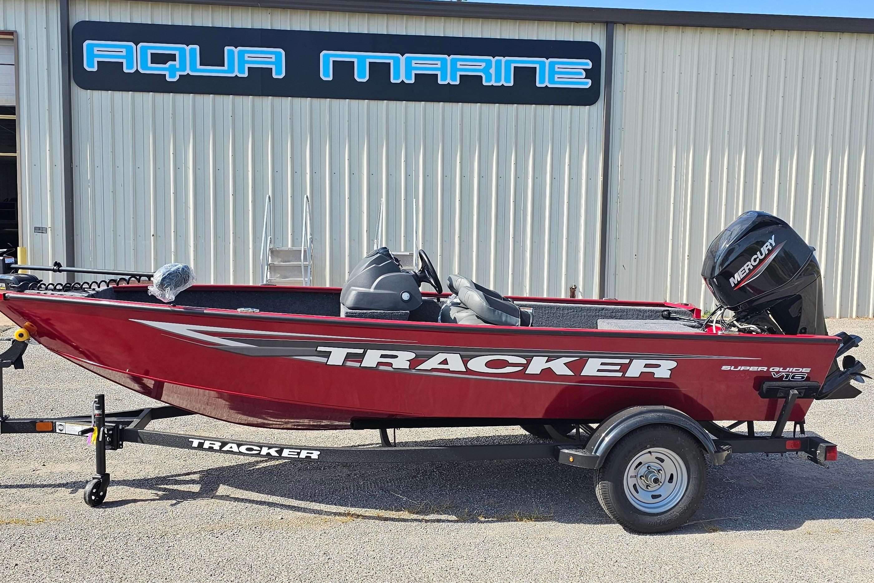 Tracker Super Guide V-16 SC 2026 Tracker Super Guide V-16 SC boat in front of Aqua Marine building.