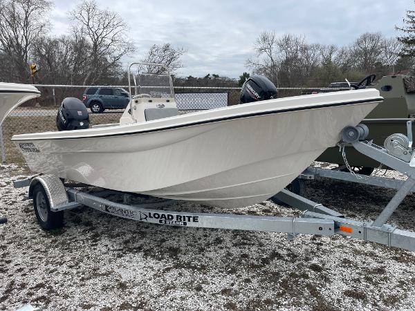 Carolina Skiff 162 JLS 2025 Carolina Skiff 162 JLS boat on Load Rite trailer, parked outdoors.