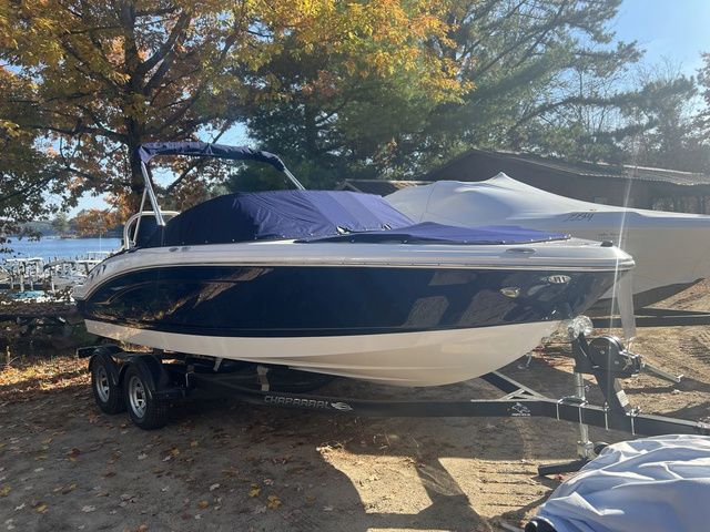 Chaparral 21 SSi OB 2025 Chaparral 21 SSi OB boat on trailer, parked outdoors under autumn trees.