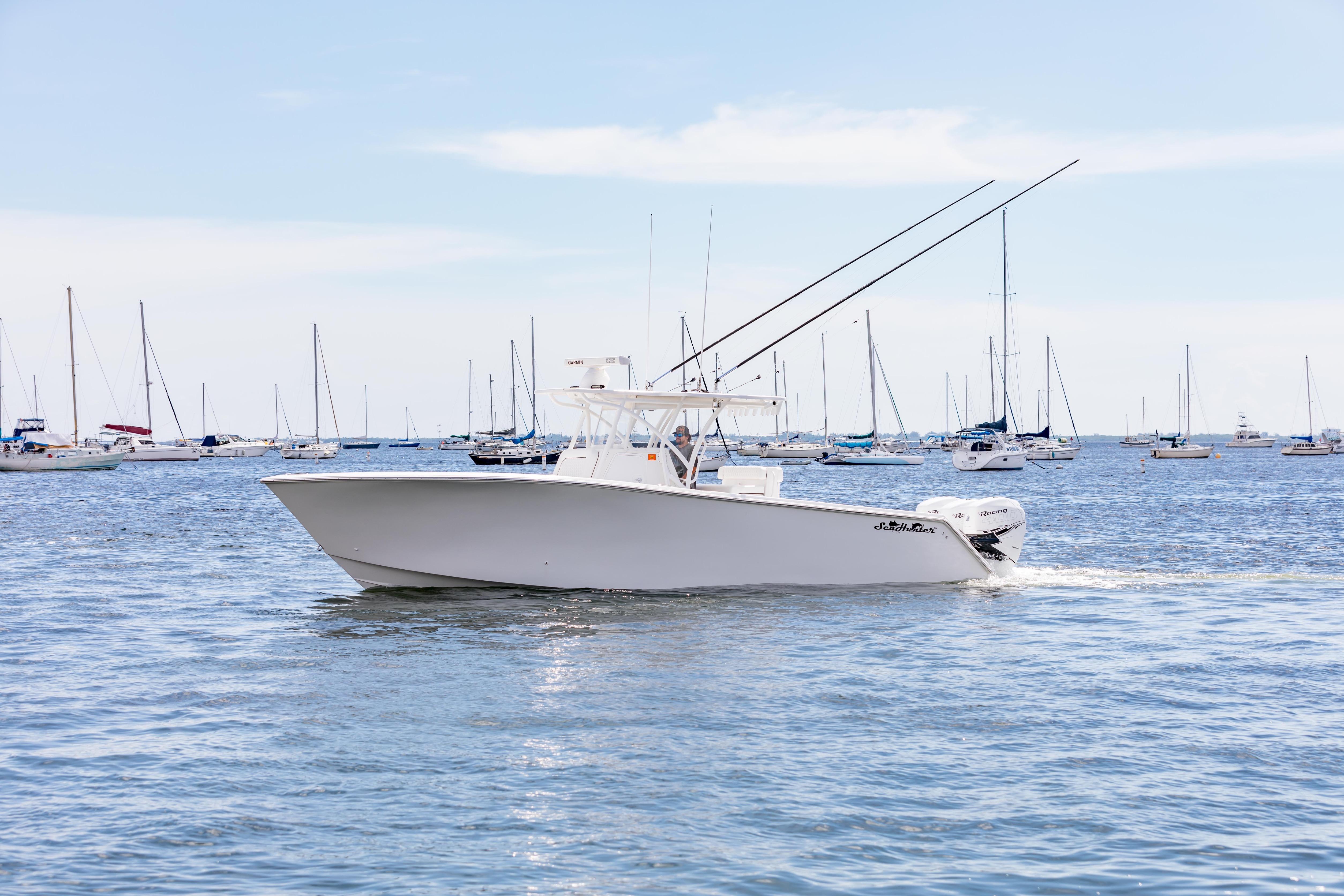 SeaHunter 33 Tournament 2020 SeaHunter 33 Tournament boat cruising in a marina with sailboats.