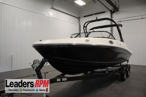 Bayliner VR6 Bowrider OB 2025 Bayliner VR6 Bowrider OB on trailer in indoor showroom.
