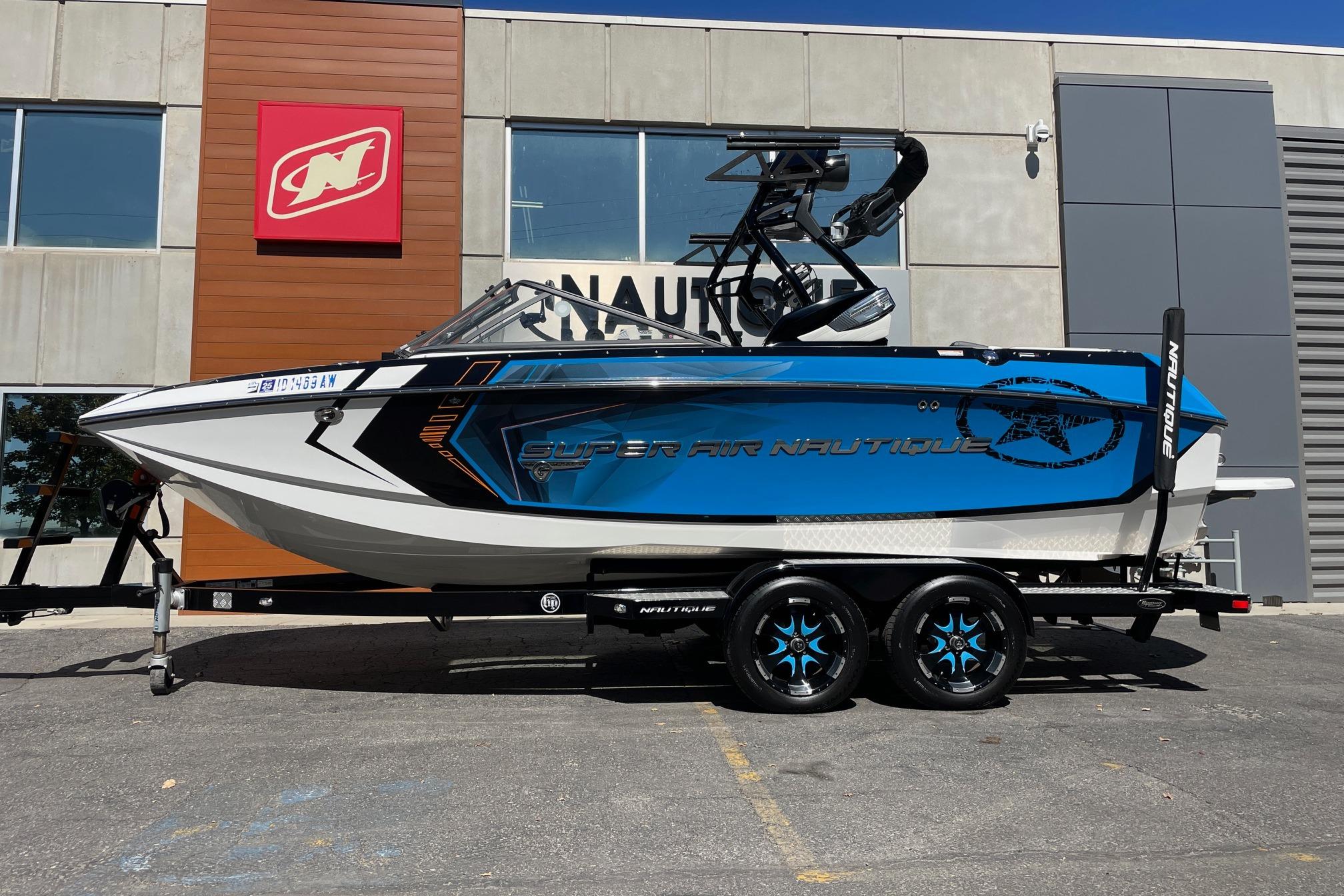 Nautique Super Air Nautique G21 2016 Nautique Super Air Nautique G21 boat on trailer outside dealership.