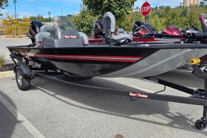 Tracker Bass Tracker Classic XL 2026 Tracker Bass Tracker Classic XL boat on trailer in parking lot.