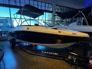 Tahoe 200 S 2024 Tahoe 200 S boat in showroom with canopy and trailer.