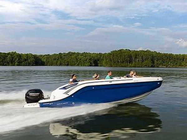 Bayliner DX2200 2023 Bayliner DX2200 boat cruising on a lake with passengers.
