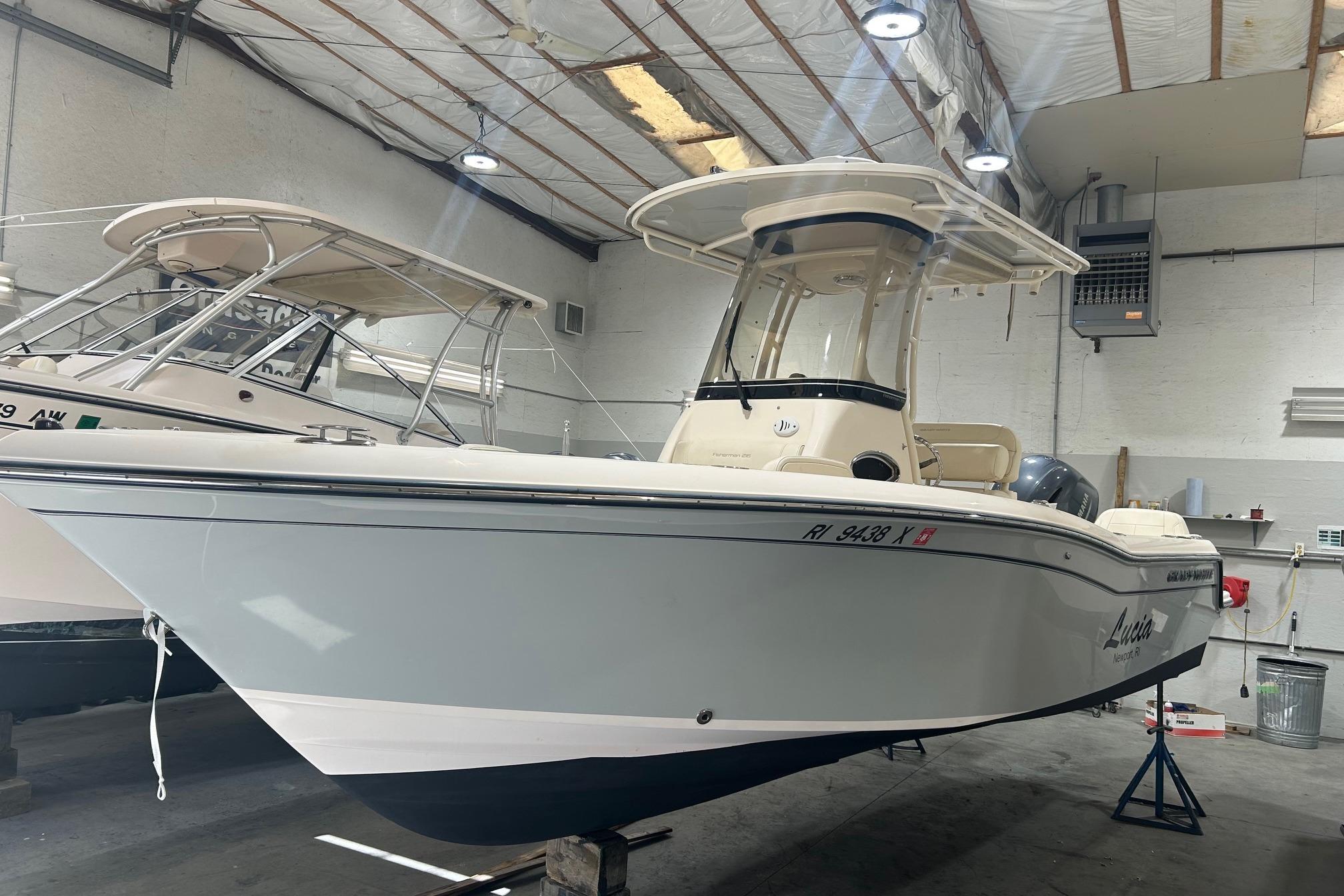 Grady-White Fisherman 216 2021 Grady-White Fisherman 216 boat in indoor storage, side view.