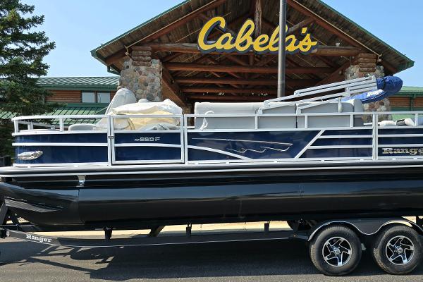 Ranger Reata 220F 2024 Ranger Reata 220F boat on trailer outside Cabela's store.