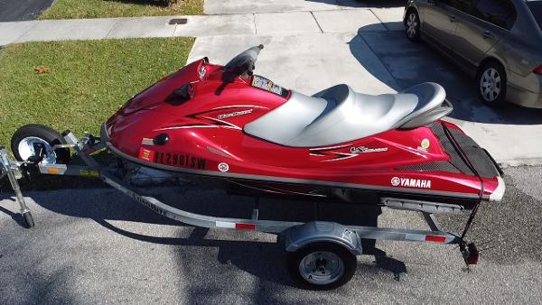 Yamaha WaveRunner VX Cruiser 2014 Yamaha WaveRunner VX Cruiser in red on a trailer, parked on a driveway.