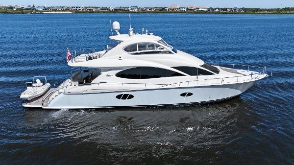 Lazzara 68 Pilothouse Motoryacht 2005 Lazzara 68 Pilothouse Motoryacht cruising on calm blue waters.