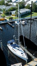 Jeanneau Sun Odyssey 36i Sailboat Jeanneau Sun Odyssey 36i, 2010 model, docked in a marina with lush surroundings.