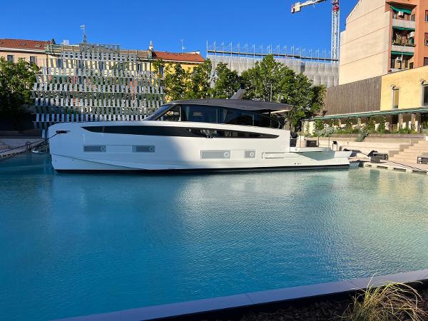 Azimut Seadeck 6 2025 Azimut Seadeck 6 yacht docked in a modern urban marina.