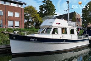 Grand Banks 32 1977 Grand Banks 32 yacht docked near brick buildings, labeled "Amigo."