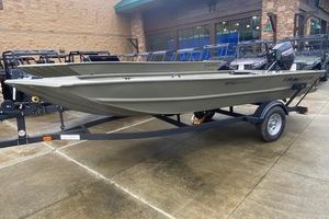Tracker Grizzly 1654 T Sportsman 2026 Tracker Grizzly 1654 T Sportsman boat on trailer, displayed outdoors.