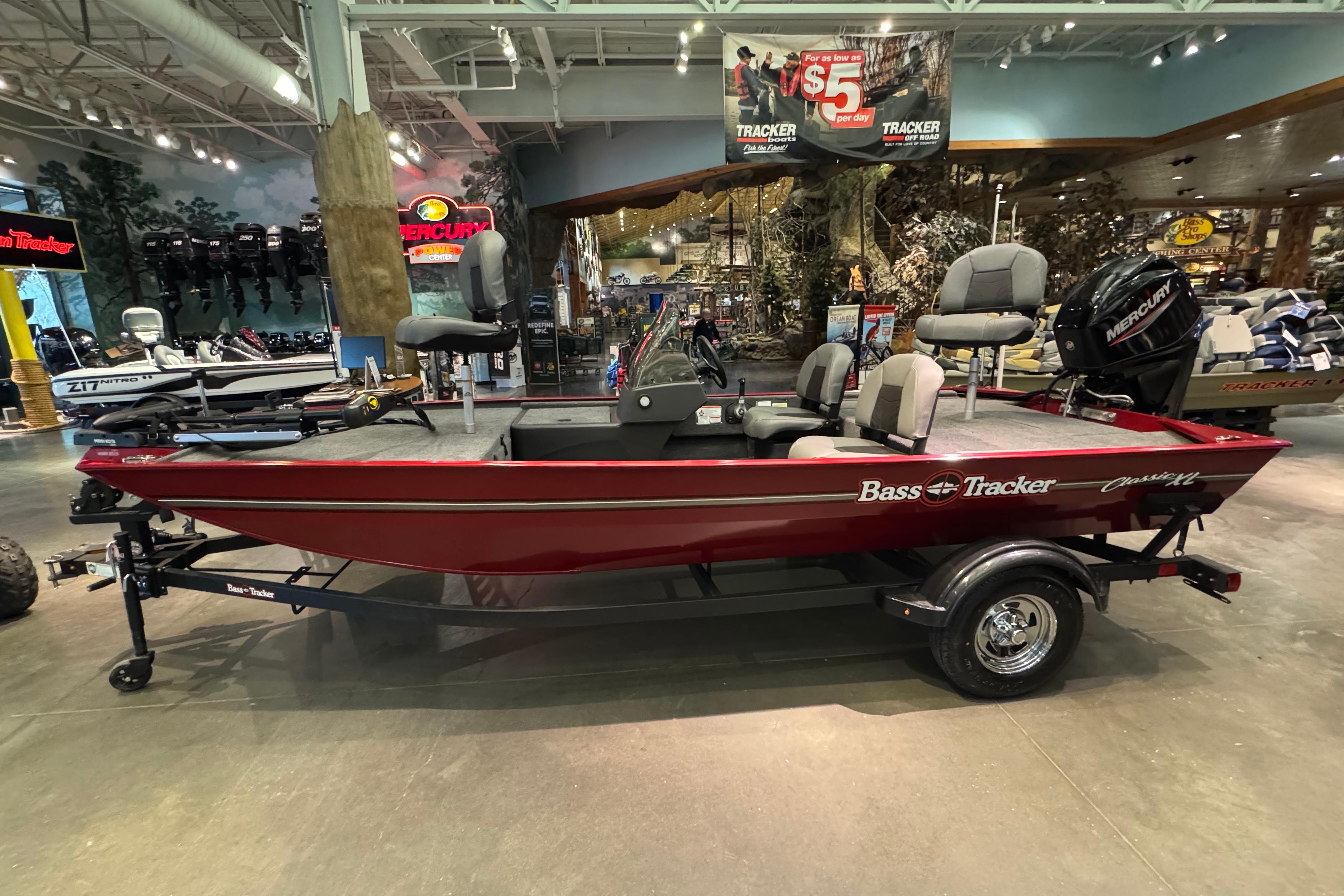 Tracker Bass Tracker Classic XL 2026 Tracker Bass Tracker Classic XL boat in showroom, red exterior, equipped with Mercury engine.