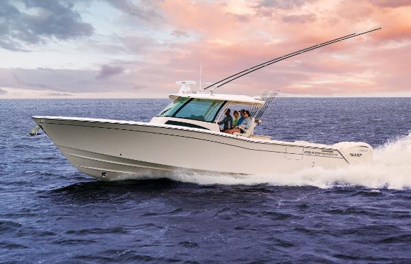 Grady-White 386 Canyon 2024 Grady-White 386 Canyon boat cruising on open water at sunset.