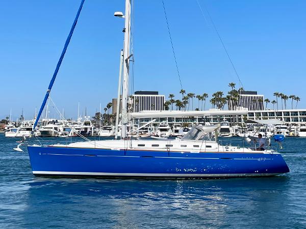 Beneteau First 47.7 2002 Beneteau First 47.7 sailboat with blue hull in a marina setting.