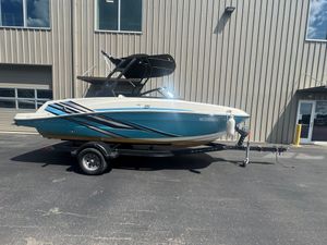 Bayliner VR5 Bowrider I/O 2023 Bayliner VR5 Bowrider I/O boat on trailer, parked outside a building.