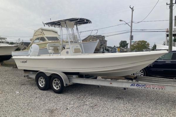 Bulls Bay 2400 2023 Bulls Bay 2400 boat on trailer, parked in a gravel lot.