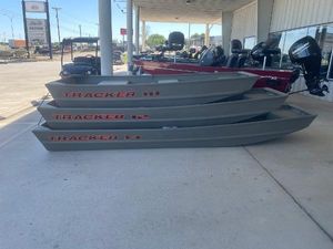 Tracker Grizzly 14 Jon 2025 Tracker Grizzly 14 Jon boats displayed outdoors at a dealership.