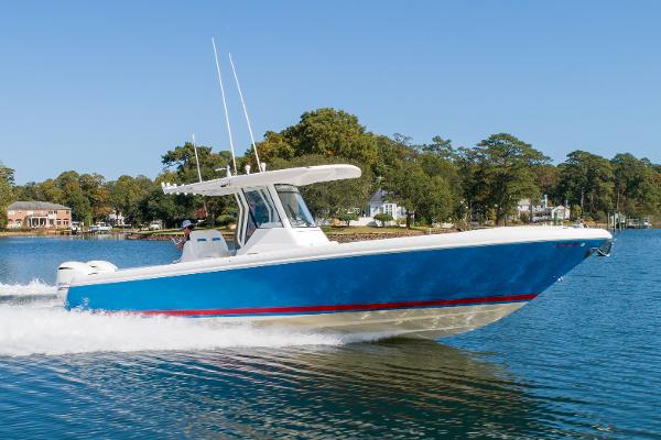Intrepid 327 Center Console 2015 Intrepid 327 Center Console boat cruising on a calm lake.