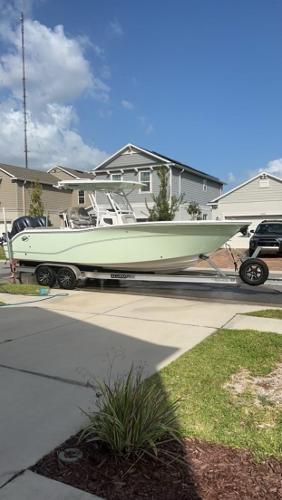 Sea Fox 268 Commander 2021 Sea Fox 286 Commander boat on a trailer in a residential driveway.
