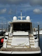 Riviera 60SY 2018 Riviera 60SY 2018 yacht docked at marina under blue sky.